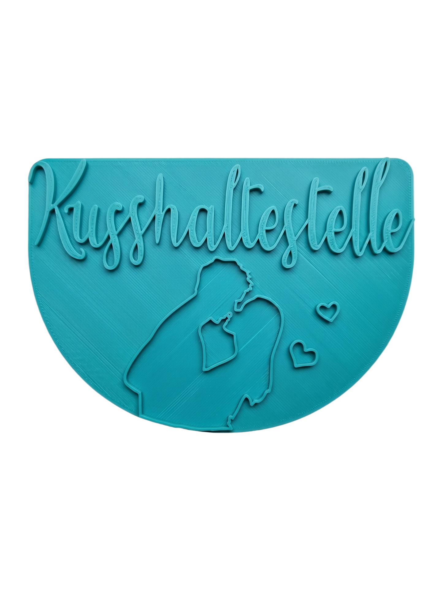 Türkisfarbener Keramikstempel für Ton mit dem Schriftzug Kusshaltestelle und der Silhouette eines küssenden Paares. Detailreiches, handgefertigtes Töpferwerkzeug für romantische Projekte.