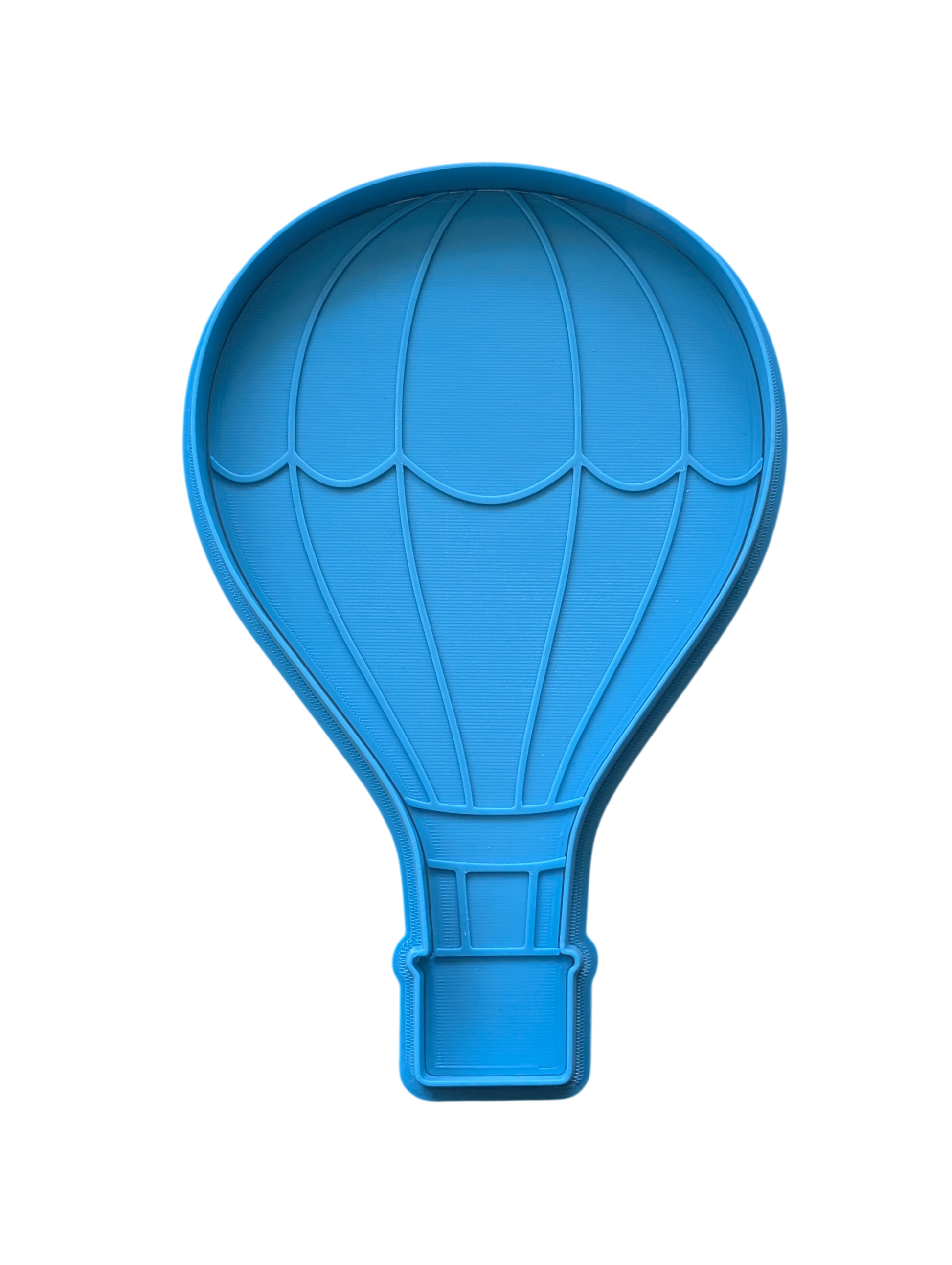 Zweiteiliges Set aus Ausstechform und Prägeplatte in Form eines Heißluftballons. Hochwertiges, türkisfarbenes Töpferwerkzeug für detailreiche Projekte aus Ton.