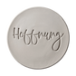 Perfekter, runder Tonabdruck mit dem tief geprägten Schriftzug Hoffnung auf schwarzem Hintergrund von MinseArt.