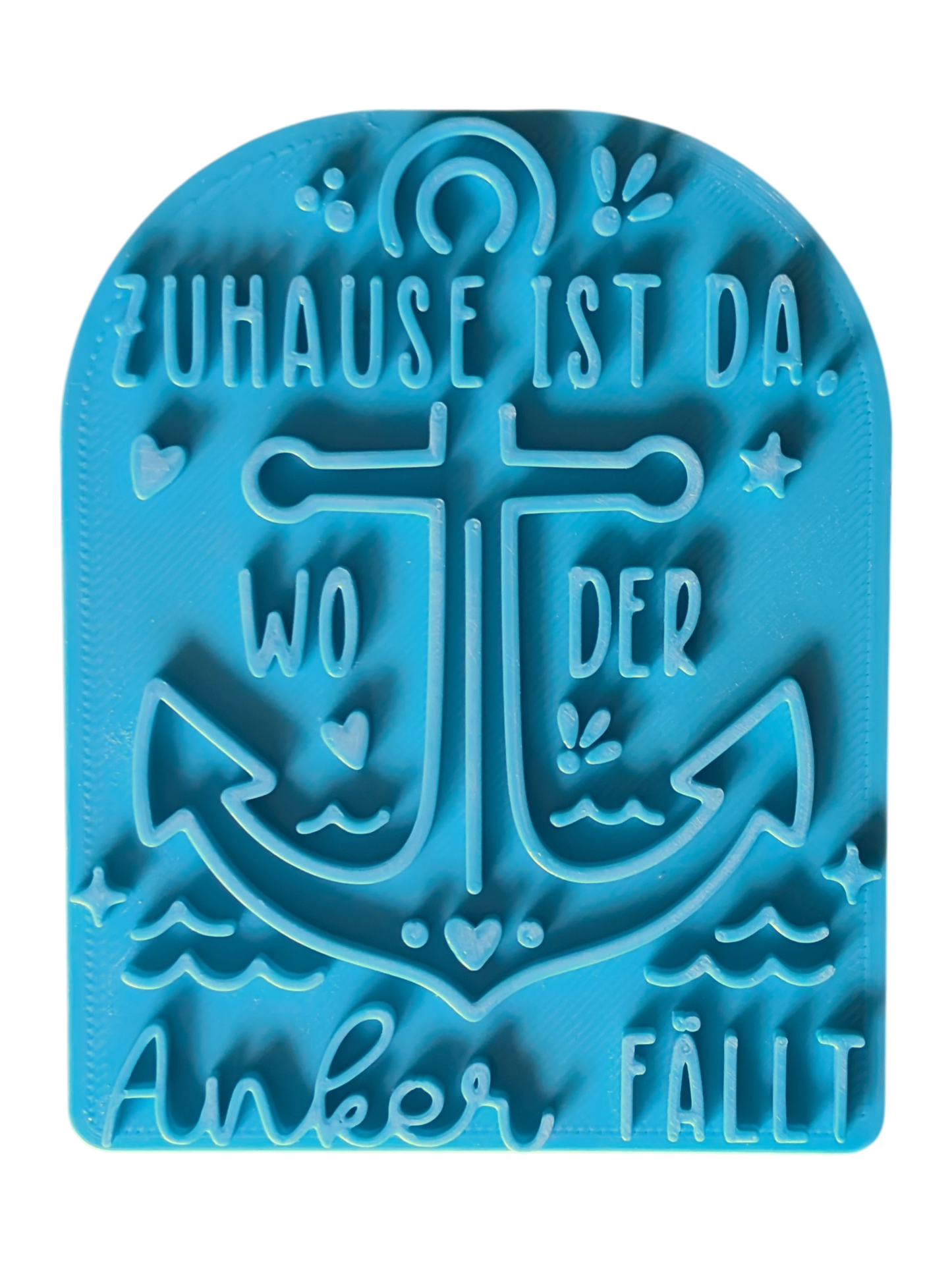Draufsicht auf den Tonstempel 'Zuhause ist da, wo der Anker fällt'. Der detailreiche Keramikstempel verfügt über eine Positionierungshilfe für exaktes Arbeiten.