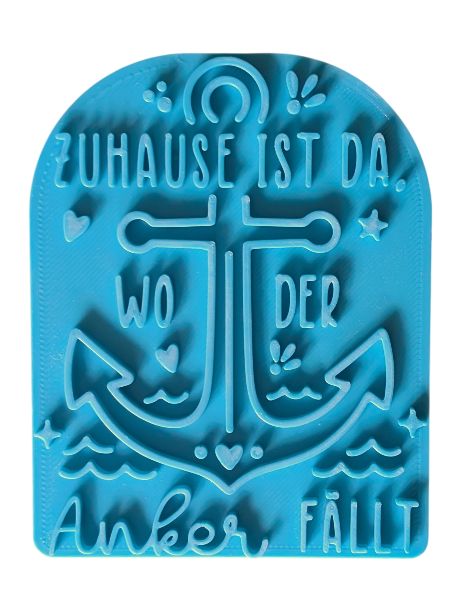 Draufsicht auf den Tonstempel 'Zuhause ist da, wo der Anker fällt'. Der detailreiche Keramikstempel verfügt über eine Positionierungshilfe für exaktes Arbeiten.