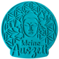 Türkisfarbener Keramikstempel für Ton mit Buddha-Motiv, Lotusblüten und der Blume des Lebens. Hochwertiges Töpferwerkzeug für eine 'kleine Auszeit' in der Keramikgestaltung.