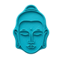 Blaugrüner Keramikstempel mit einem schlichten Buddha-Gesicht. Hochwertiges Design für klare Prägungen in Ton und Keramik.