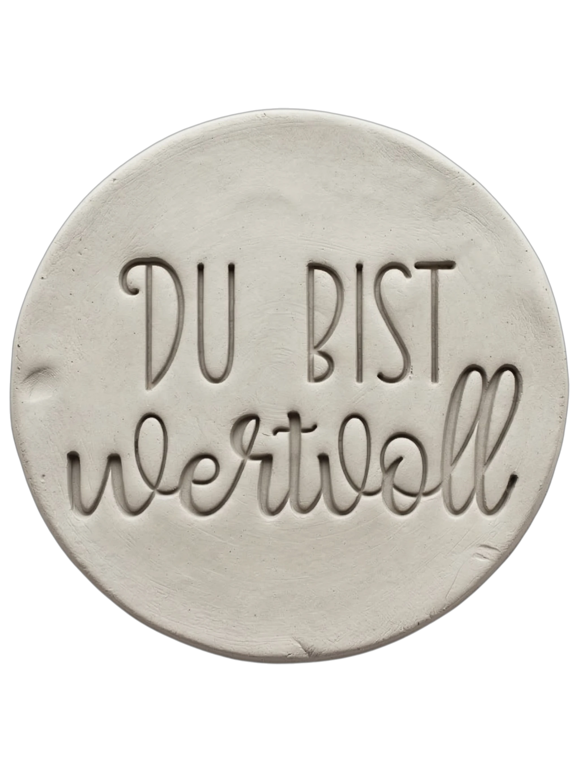 Sauberer Stempelabdruck im hellen Ton mit dem Schriftzug 'DU BIST wertvoll'. Kombination aus moderner Druckschrift und eleganter Schreibschrift, erstellt mit einem MinseArt Keramikstempel.