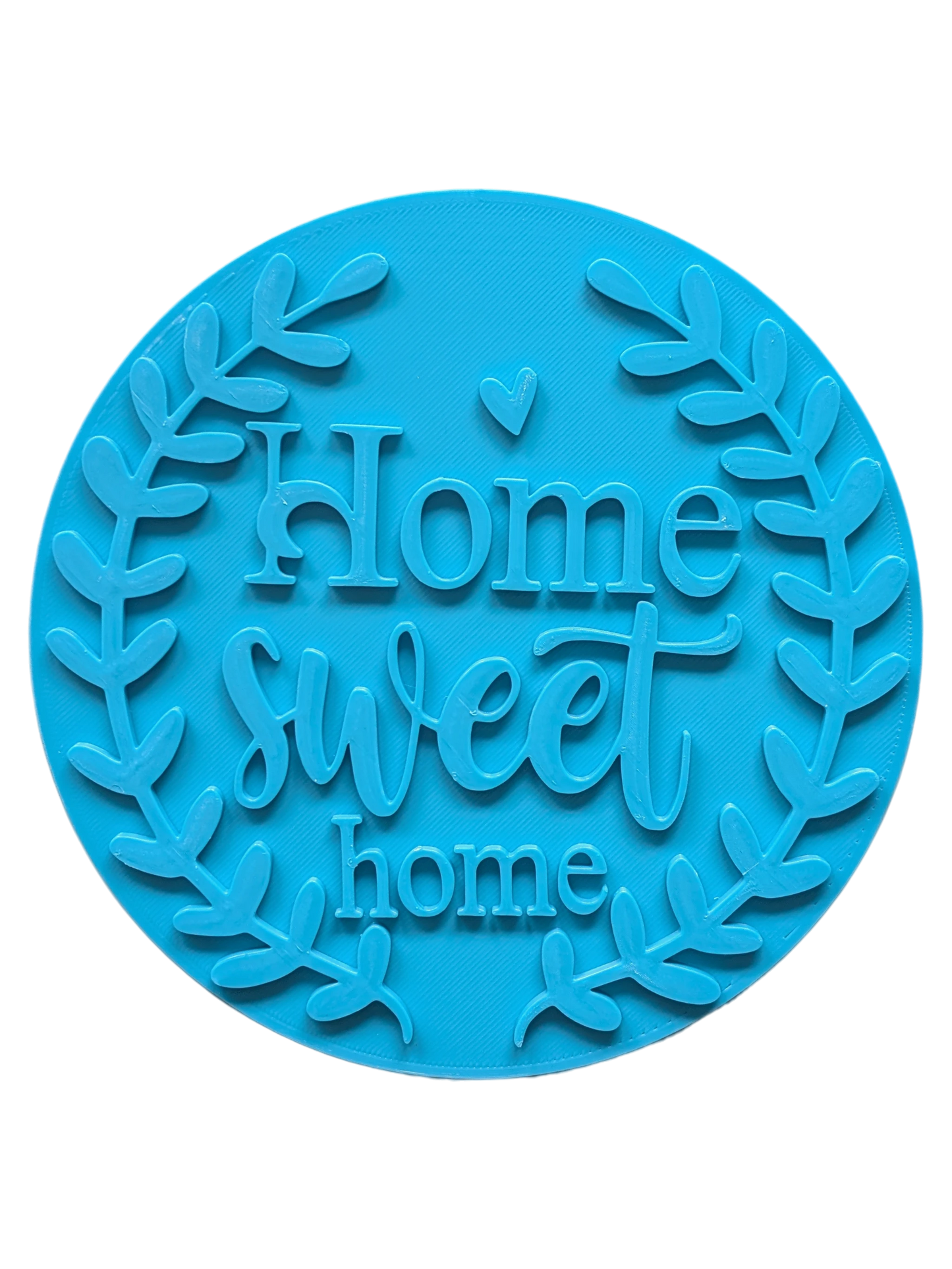 Draufsicht auf den türkisfarbenen Keramikstempel 'Home sweet home' mit einem dekorativen Blätterkranz. Ein detailreicher Textstempel für liebevolle Töpfer-Ideen und Türschilder.