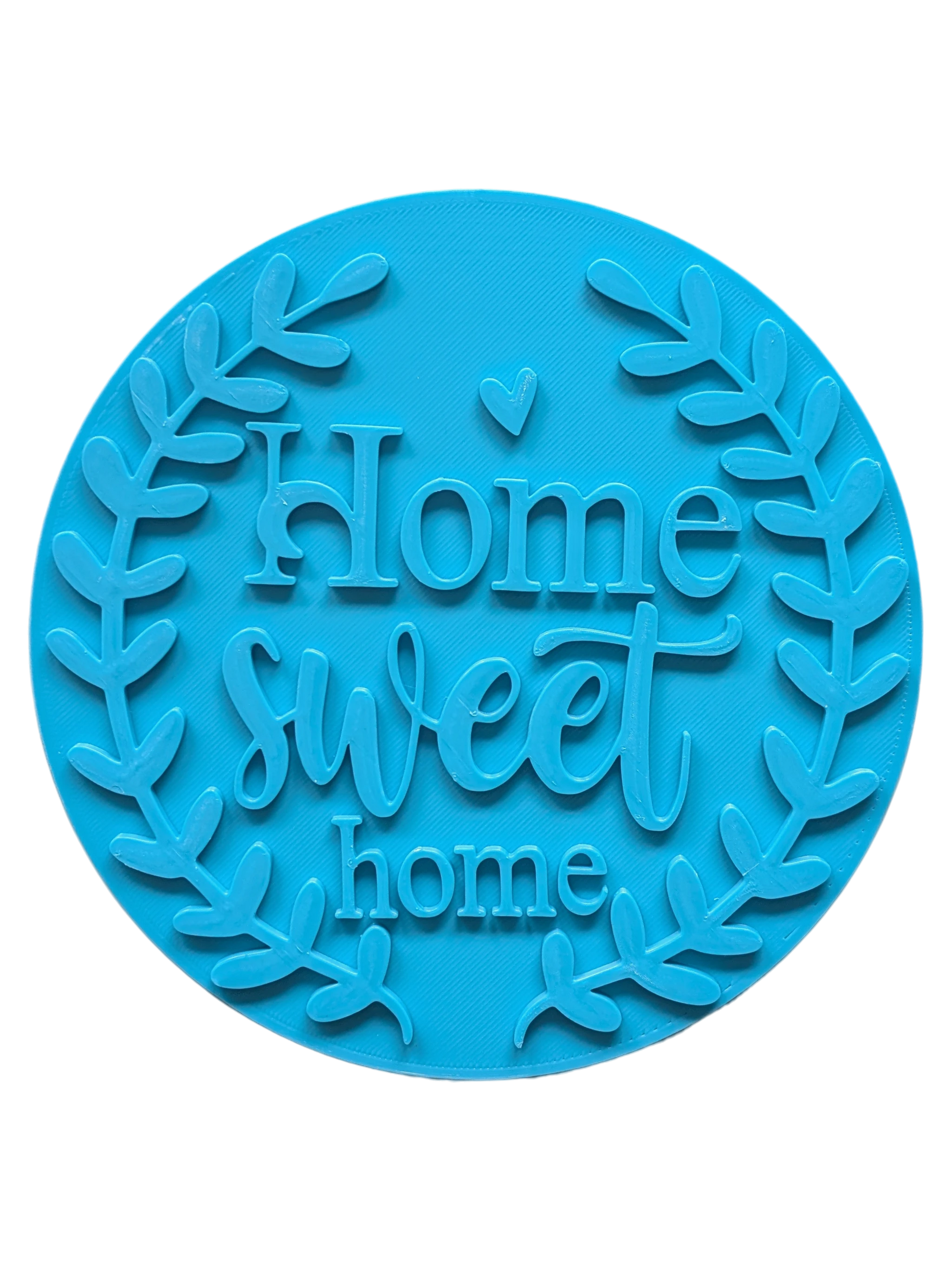 Draufsicht auf den türkisfarbenen Keramikstempel 'Home sweet home' mit einem dekorativen Blätterkranz. Ein detailreicher Textstempel für liebevolle Töpfer-Ideen und Türschilder.