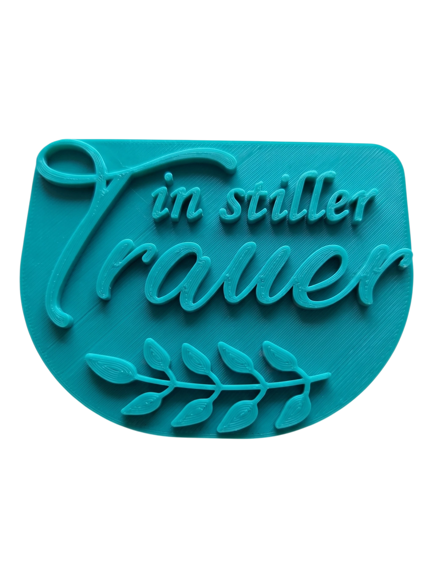 Draufsicht auf den türkisfarbenen Keramikstempel 'in stiller Trauer'. Ein hochwertiges Töpferwerkzeug für würdevolle Andenken und personalisierten Grabschmuck.