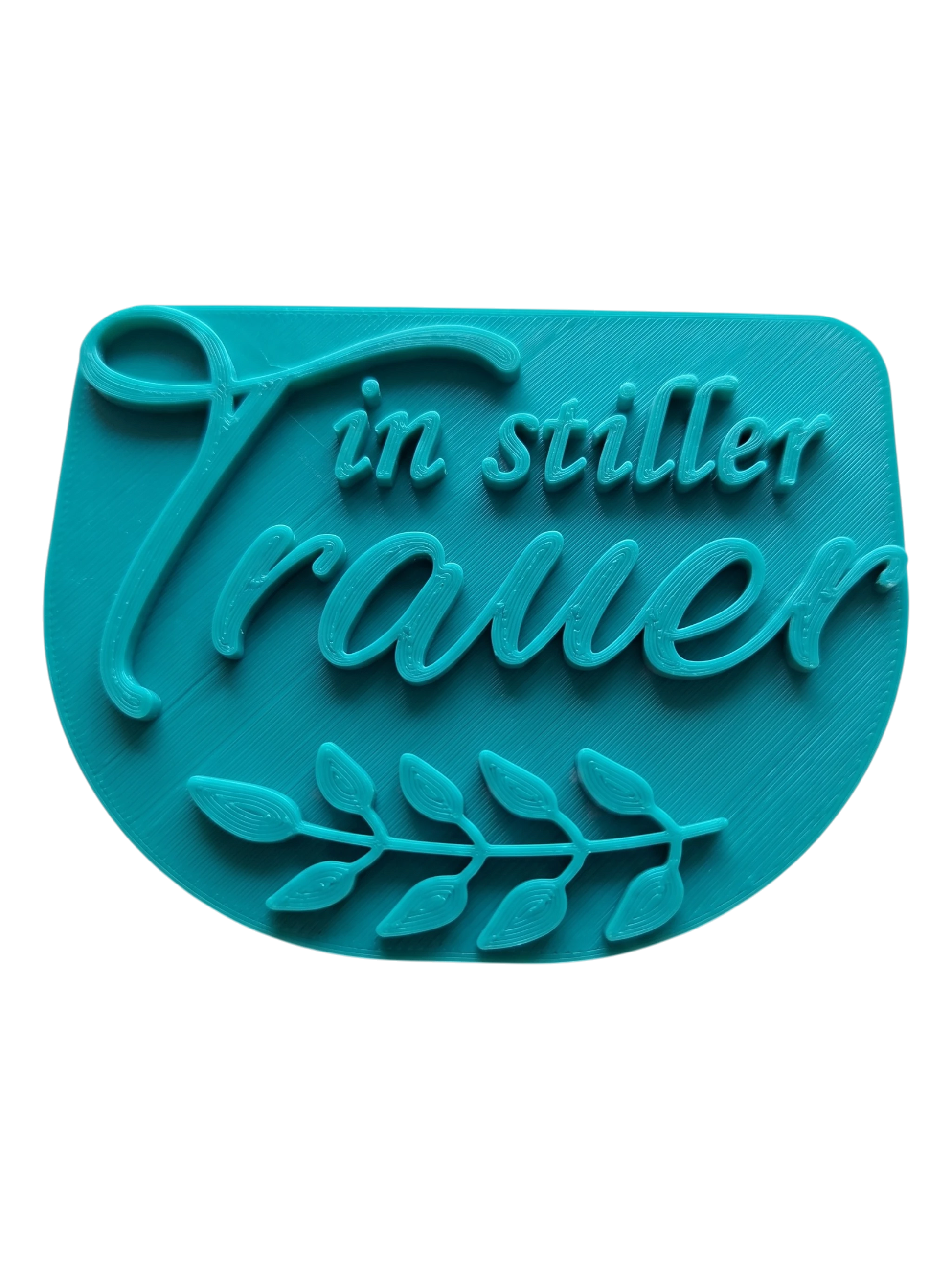 Draufsicht auf den türkisfarbenen Keramikstempel 'in stiller Trauer'. Ein hochwertiges Töpferwerkzeug für würdevolle Andenken und personalisierten Grabschmuck.