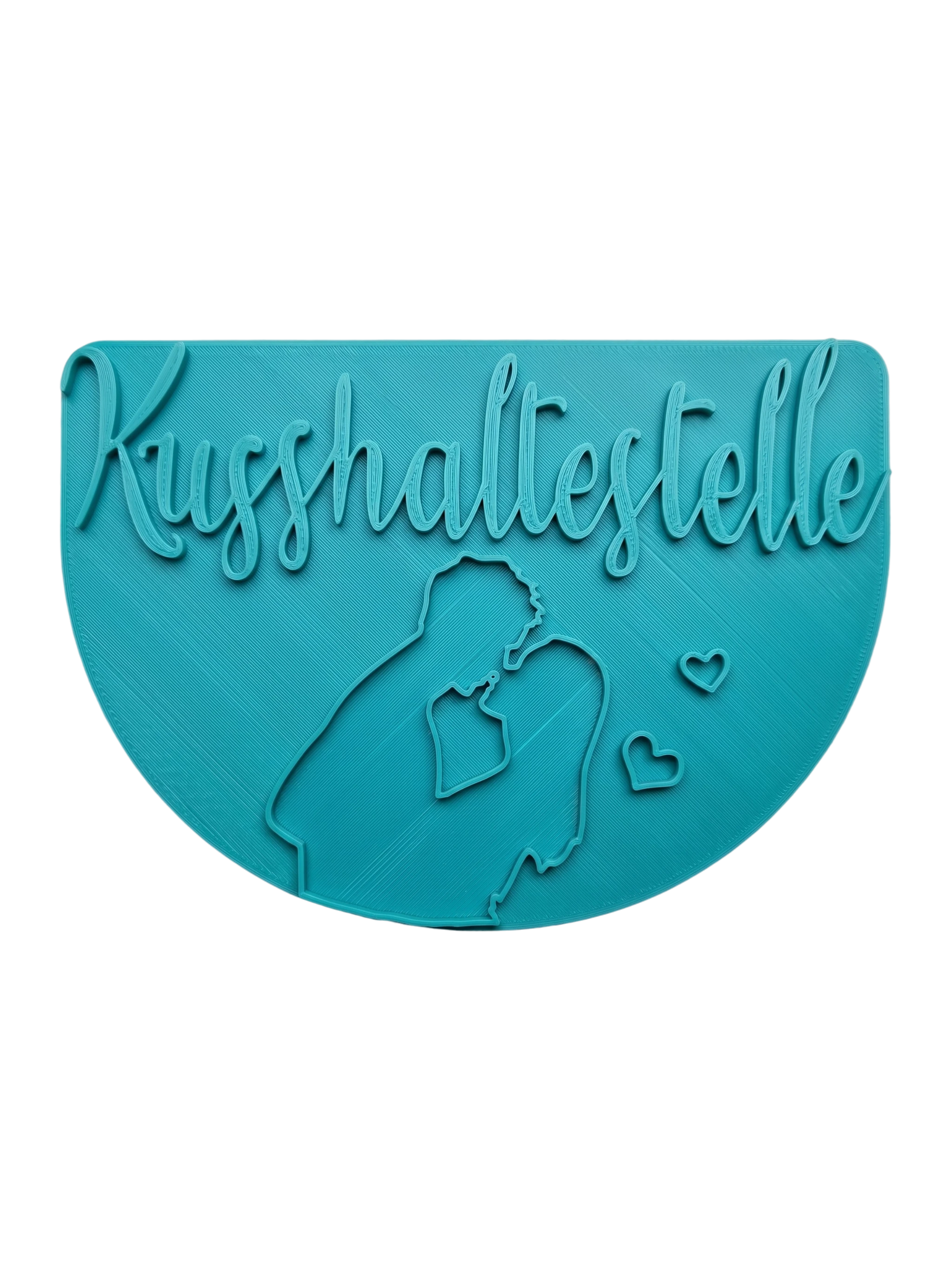 Türkisfarbener Keramikstempel für Ton mit dem Schriftzug Kusshaltestelle und der Silhouette eines küssenden Paares. Detailreiches, handgefertigtes Töpferwerkzeug für romantische Projekte.
