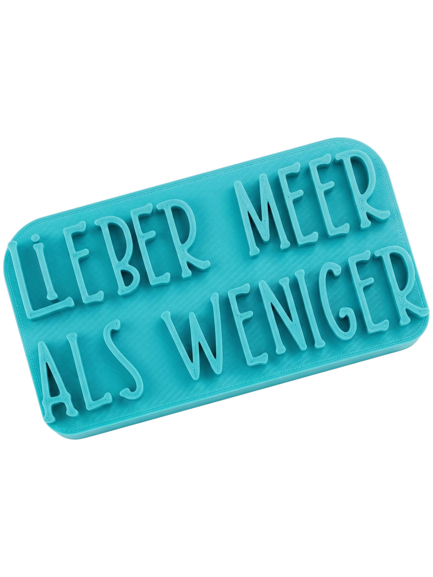 Türkisfarbener Keramikstempel für Ton mit dem Schriftzug 'Lieber Meer als weniger'. Präzises Töpferwerkzeug für detailreiche Textprägungen.