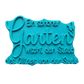 Türkisfarbener Keramikstempel für Ton mit dem Schriftzug 'Ein schöner Garten wischt den Staub des Alltags von der Seele' und einem zarten Blumenmotiv. Hochwertiges Töpferwerkzeug für detailgetreue Prägungen.