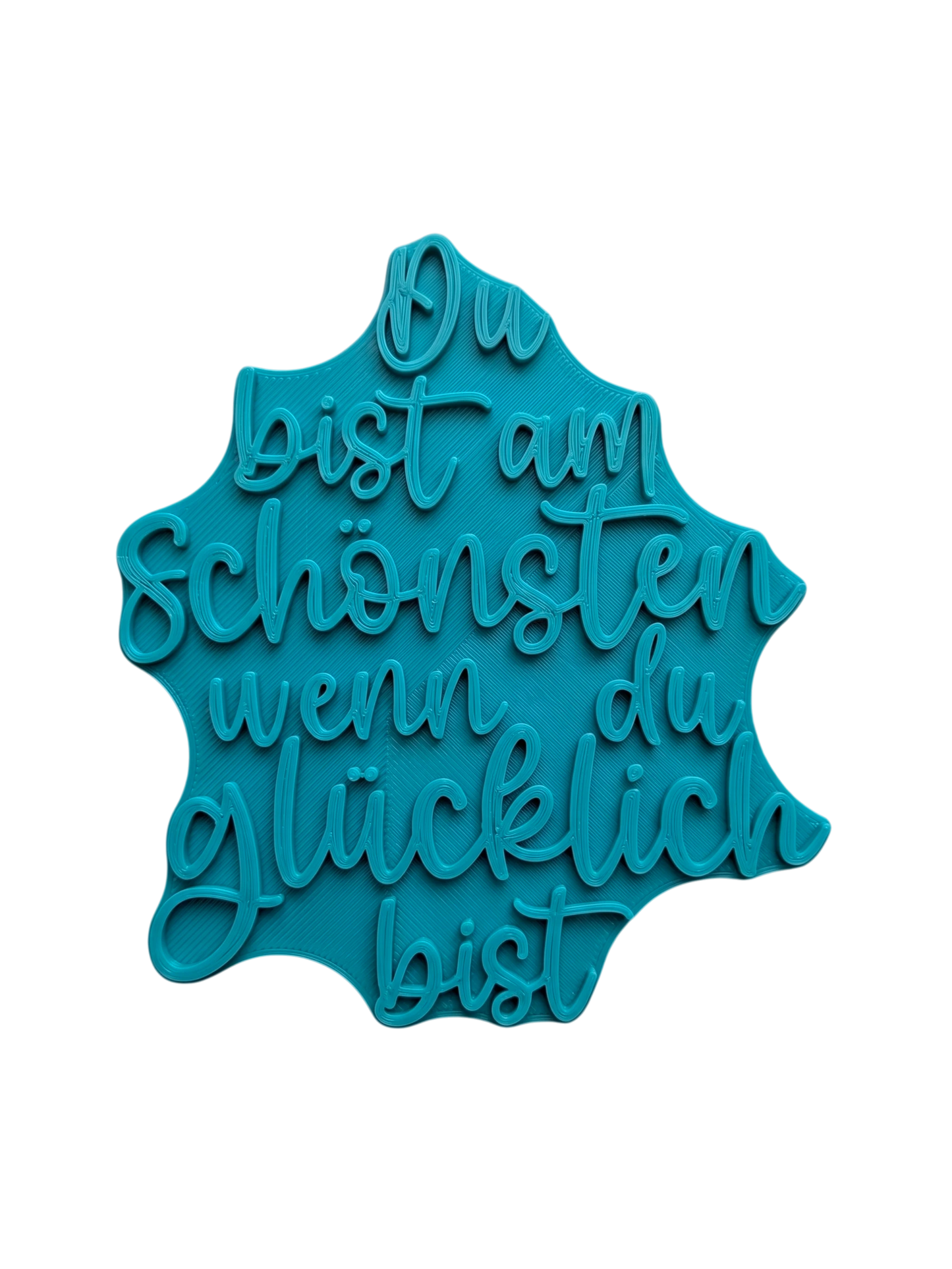 Türkisfarbener Keramikstempel für Ton mit dem motivierenden Spruch 'Du bist am Schönsten wenn du glücklich bist'. Hochwertiges Töpferwerkzeug für saubere Prägungen.