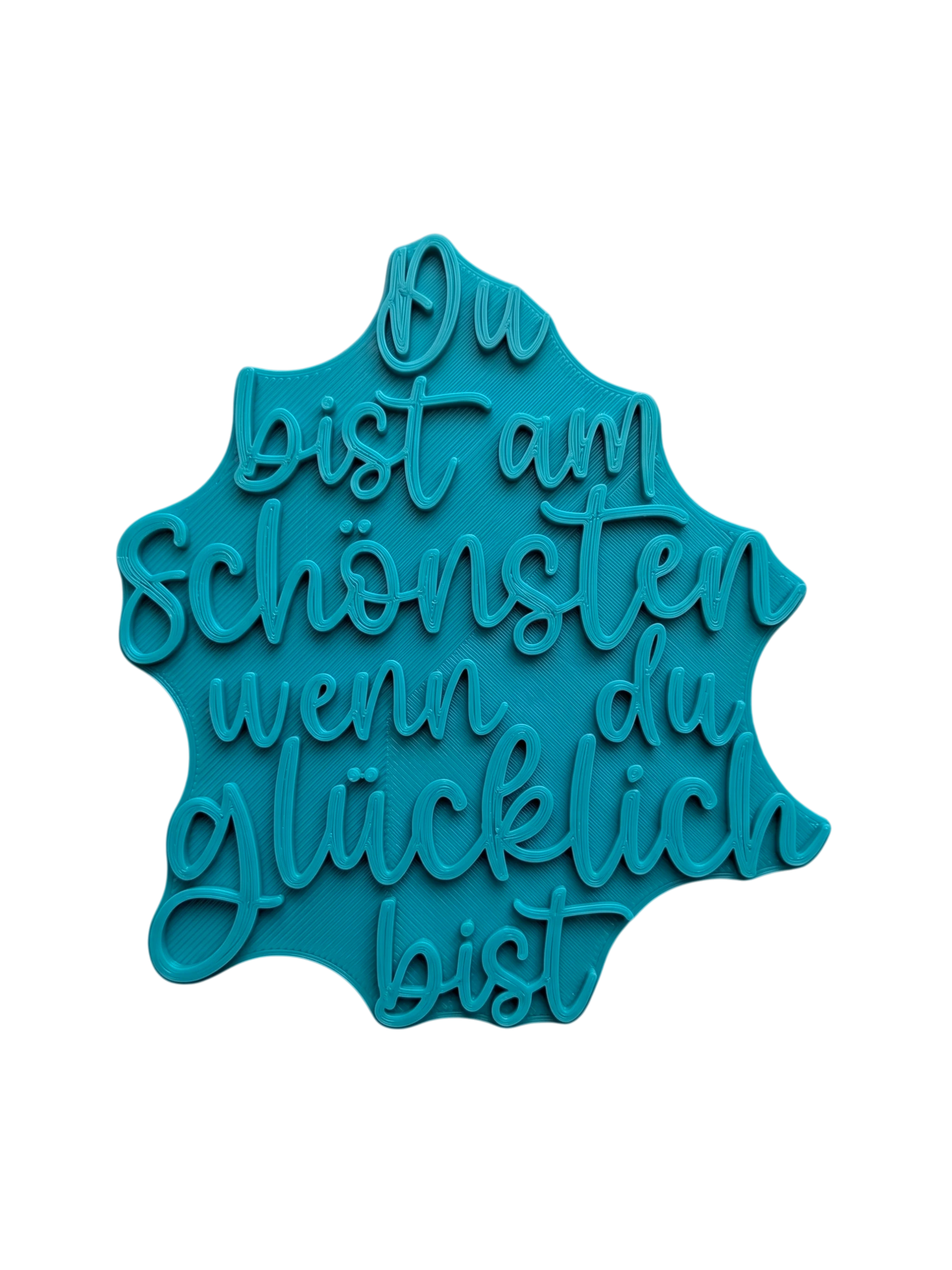 Türkisfarbener Keramikstempel für Ton mit dem motivierenden Spruch 'Du bist am Schönsten wenn du glücklich bist'. Hochwertiges Töpferwerkzeug für saubere Prägungen.