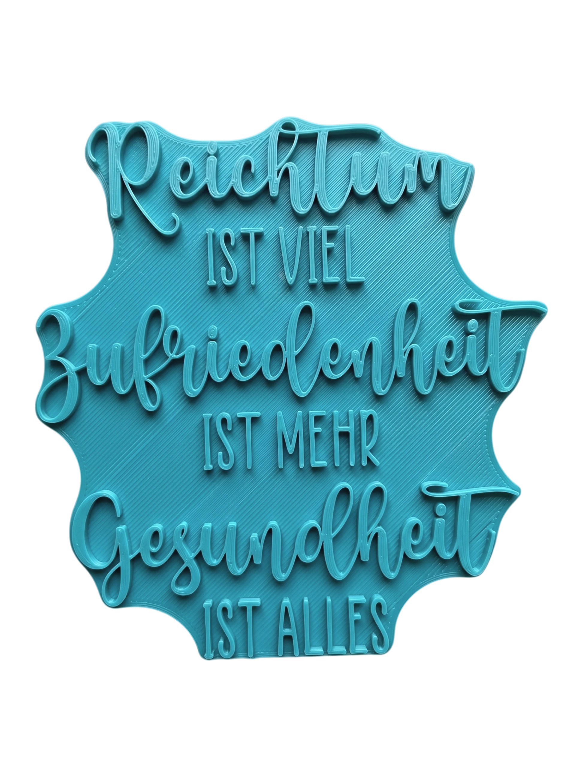 Türkisfarbener Keramikstempel für Ton mit dem Spruch 'Reichtum ist viel, Zufriedenheit ist mehr, Gesundheit ist alles'. Hochwertiges Töpferwerkzeug für präzise Textprägungen.
