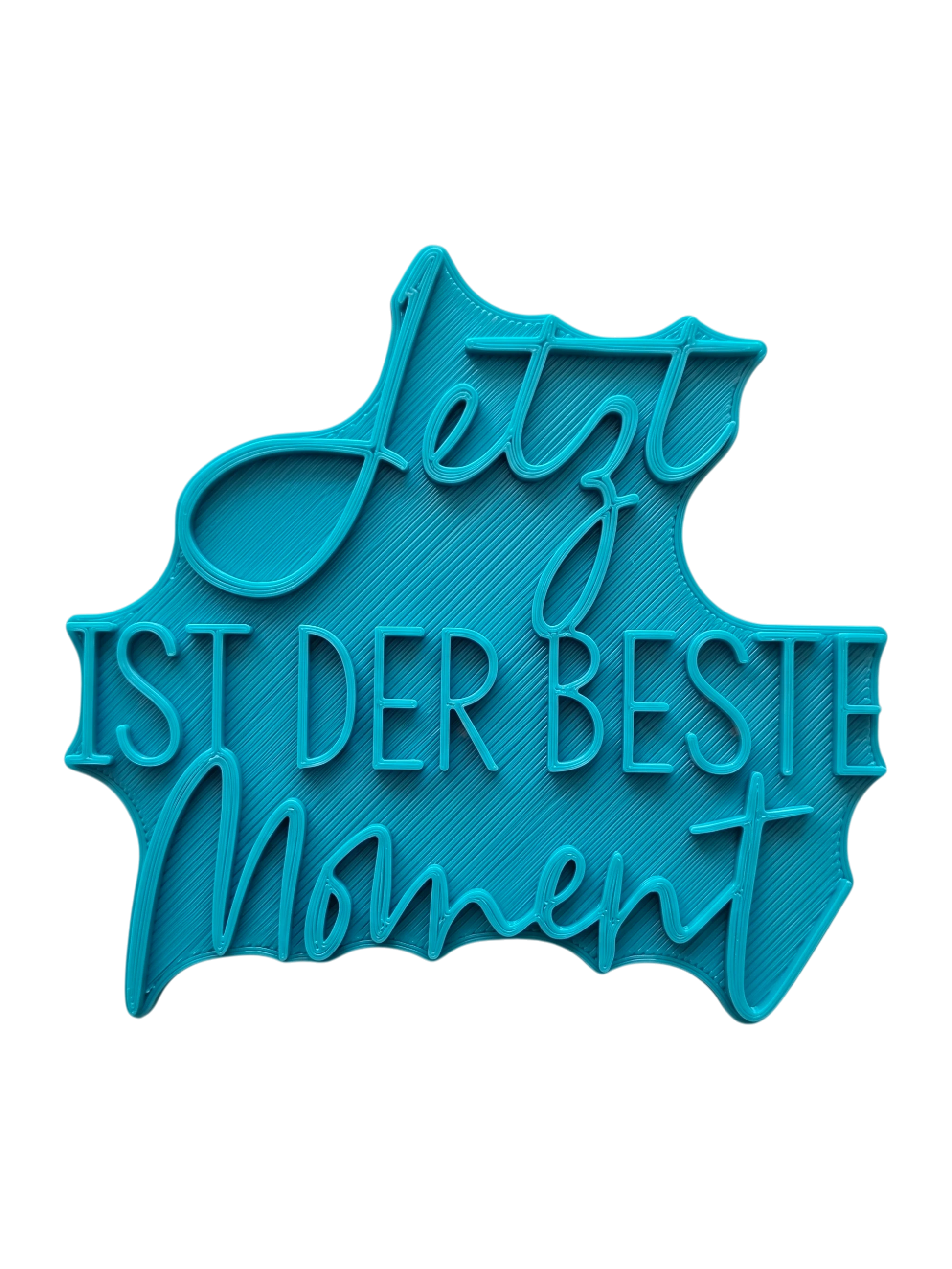 Türkisfarbener Keramikstempel für Ton mit dem achtsamen Spruch 'Jetzt ist der beste Moment'. Hochwertiges Töpferzubehör für professionelle Textprägungen.