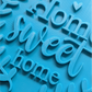 Schrägansicht des Prägestempels 'Home sweet home'. Ein hochwertiges Töpferwerkzeug für präzise Textprägungen und kreative Keramikprojekte für Zuhause.