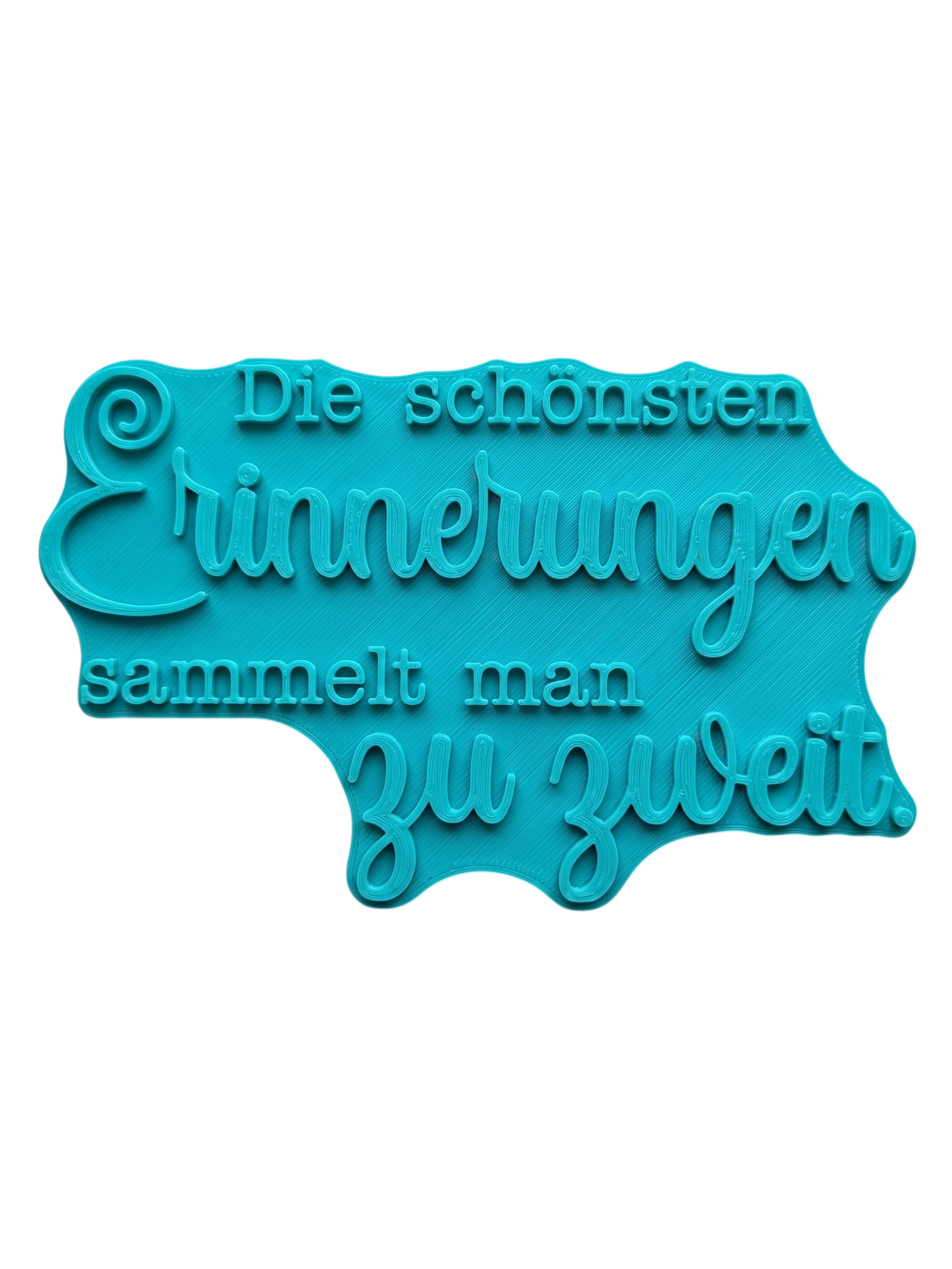 Türkisfarbener Keramikstempel für Ton mit dem Schriftzug 'Die schönsten Erinnerungen sammelt man zu zweit'. Hochwertiges und handgefertigtes Töpferwerkzeug für detailgetreue Textprägungen.