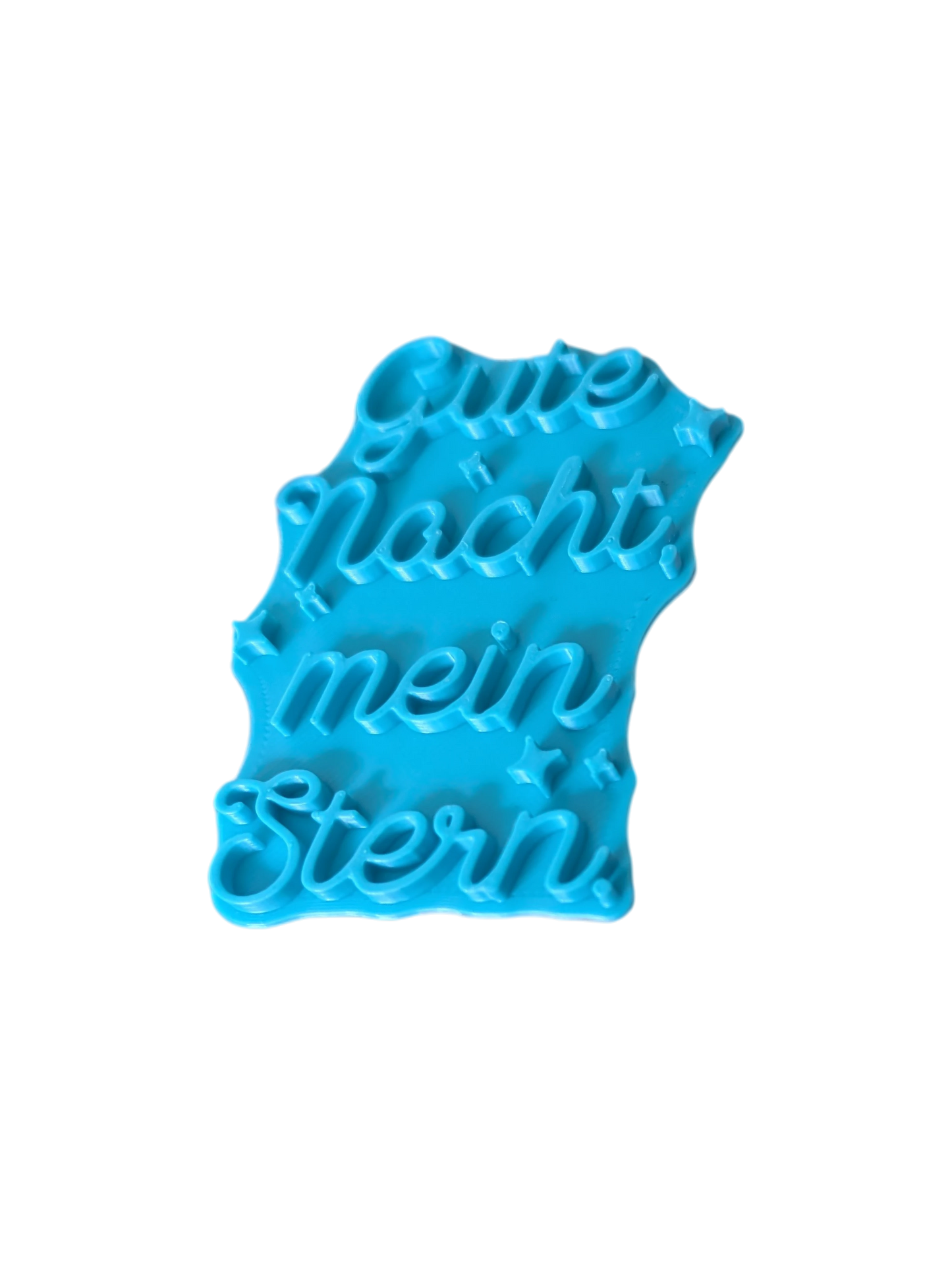 Schrägansicht des Tonstempels. Das hochwertige Töpferwerkzeug aus türkisfarbenem Material besticht durch ein tiefes, exaktes Relief für perfekte Abdrücke in der Modelliermasse.
